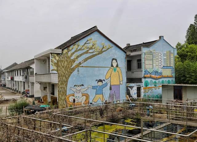 手绘墙画,为美丽乡村展开美丽画卷.